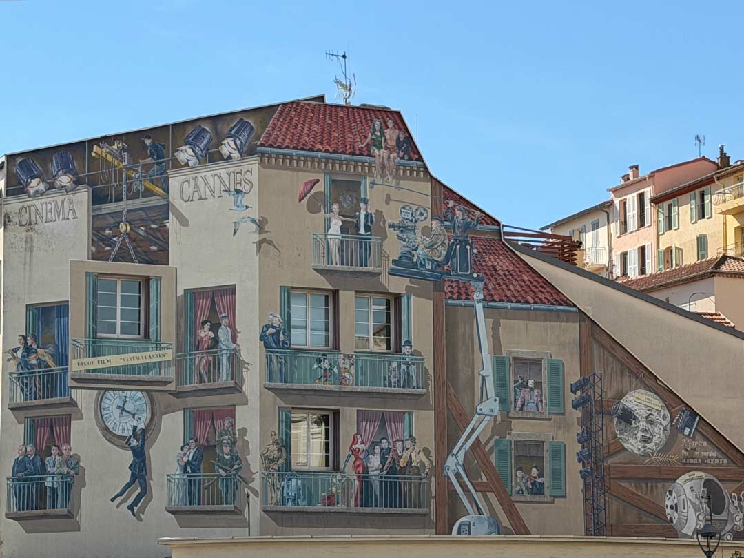 Cannes Film Building Film mural painted on the side of the building. Including some of the following characters: Charlie Chaplin, Mickey and Minnie Mouse, Jessica Rabbit, C3PO and R2D2, Batman and Joker.