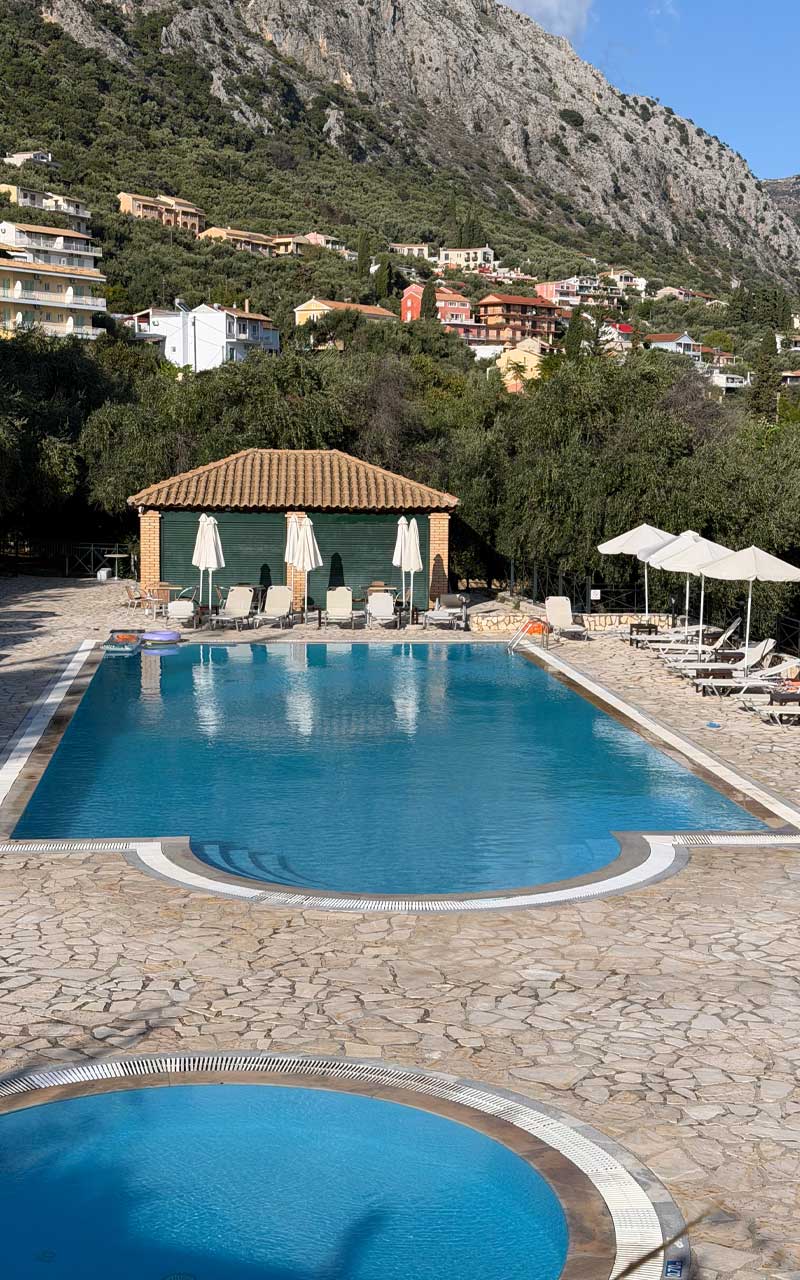House with a swimming pool and a hot-tub in the backyard.