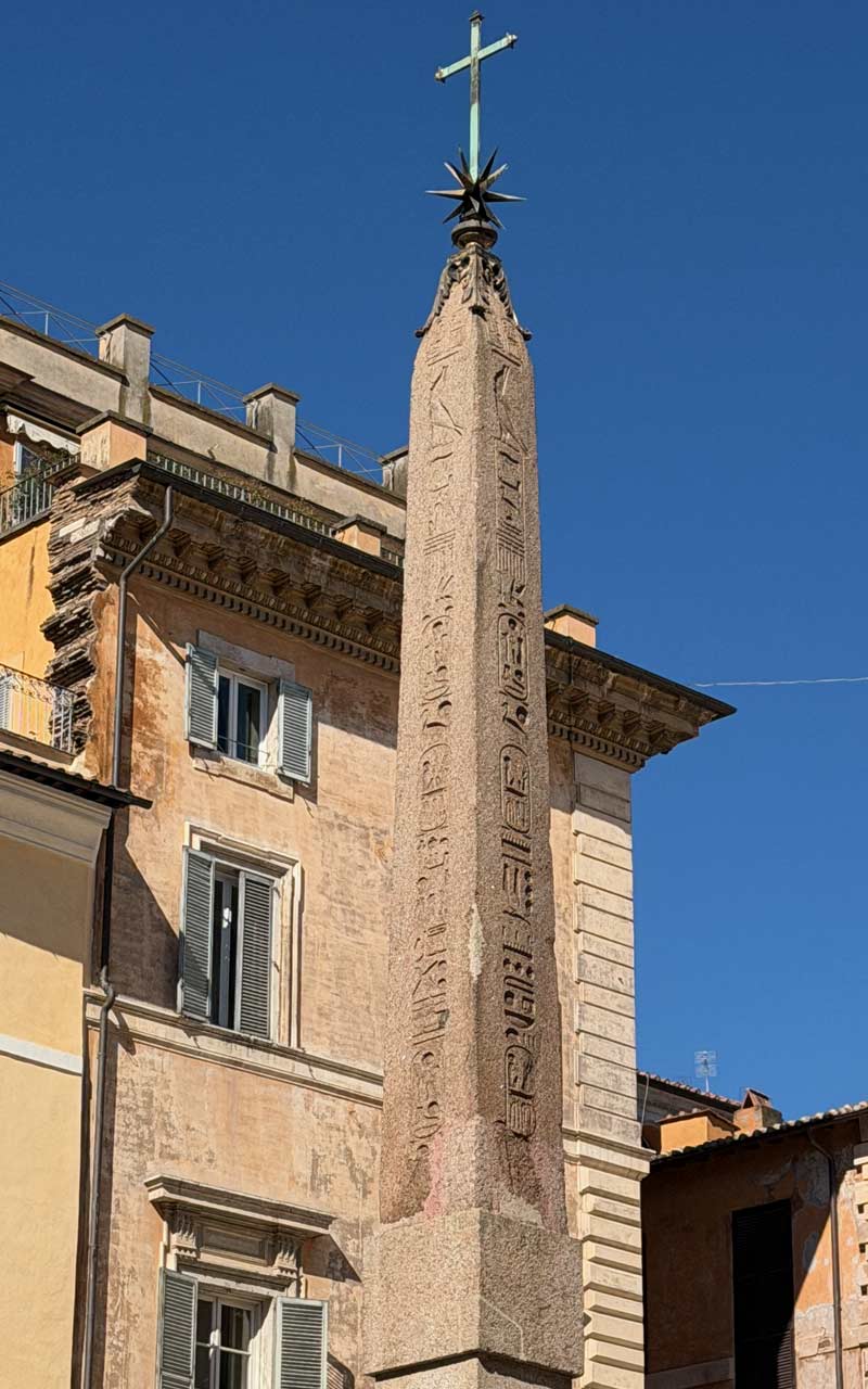 Ancient Egyptian Obelisco Macuteo with cross on top.