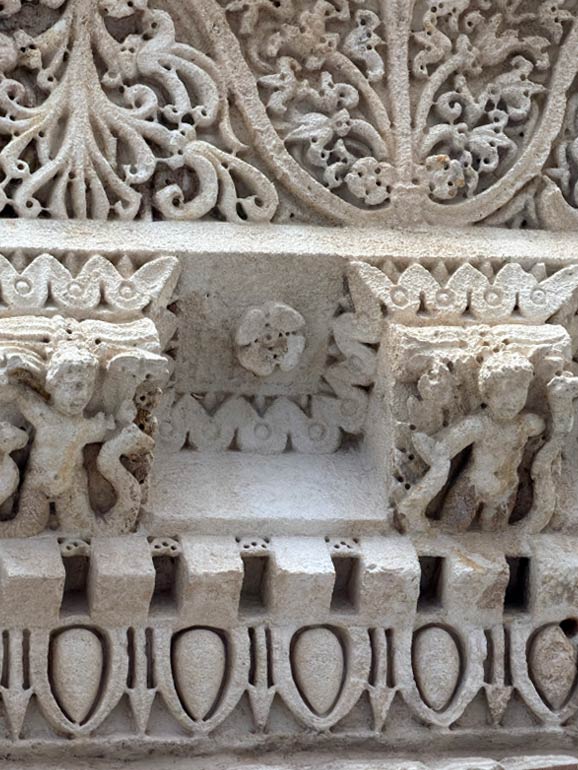 Carved Roman figures in the ceiling of Jupiters Temple.