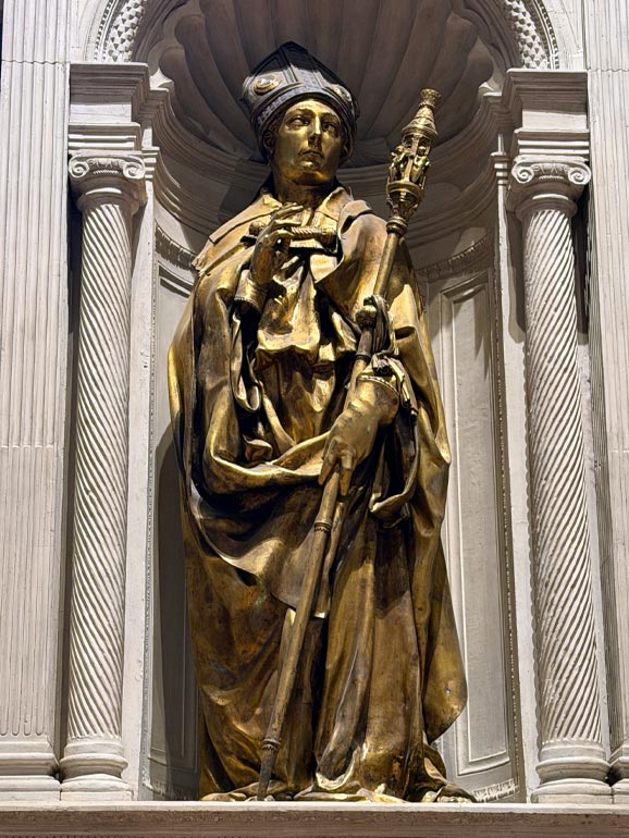 Gold priest like figure.
