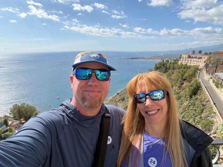 Selfie Piazza IX Aprile Gordon and Anna selfie photo with ocean and town behind them.