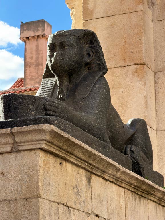 Looking at an ancient Black Granite Egyptian Sphinx statue at Diocletian's Palace