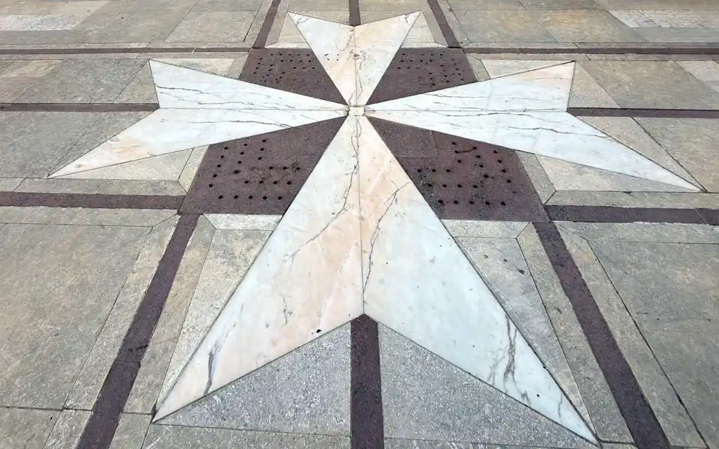 Maltese Cross Large Maltese Cross in white on the ground.