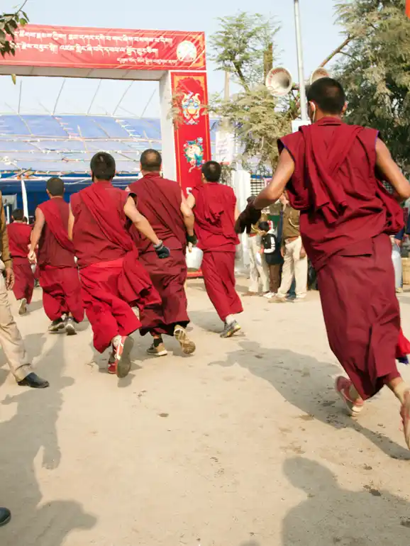 Buddhist Monks bringing hot tea to the teachings